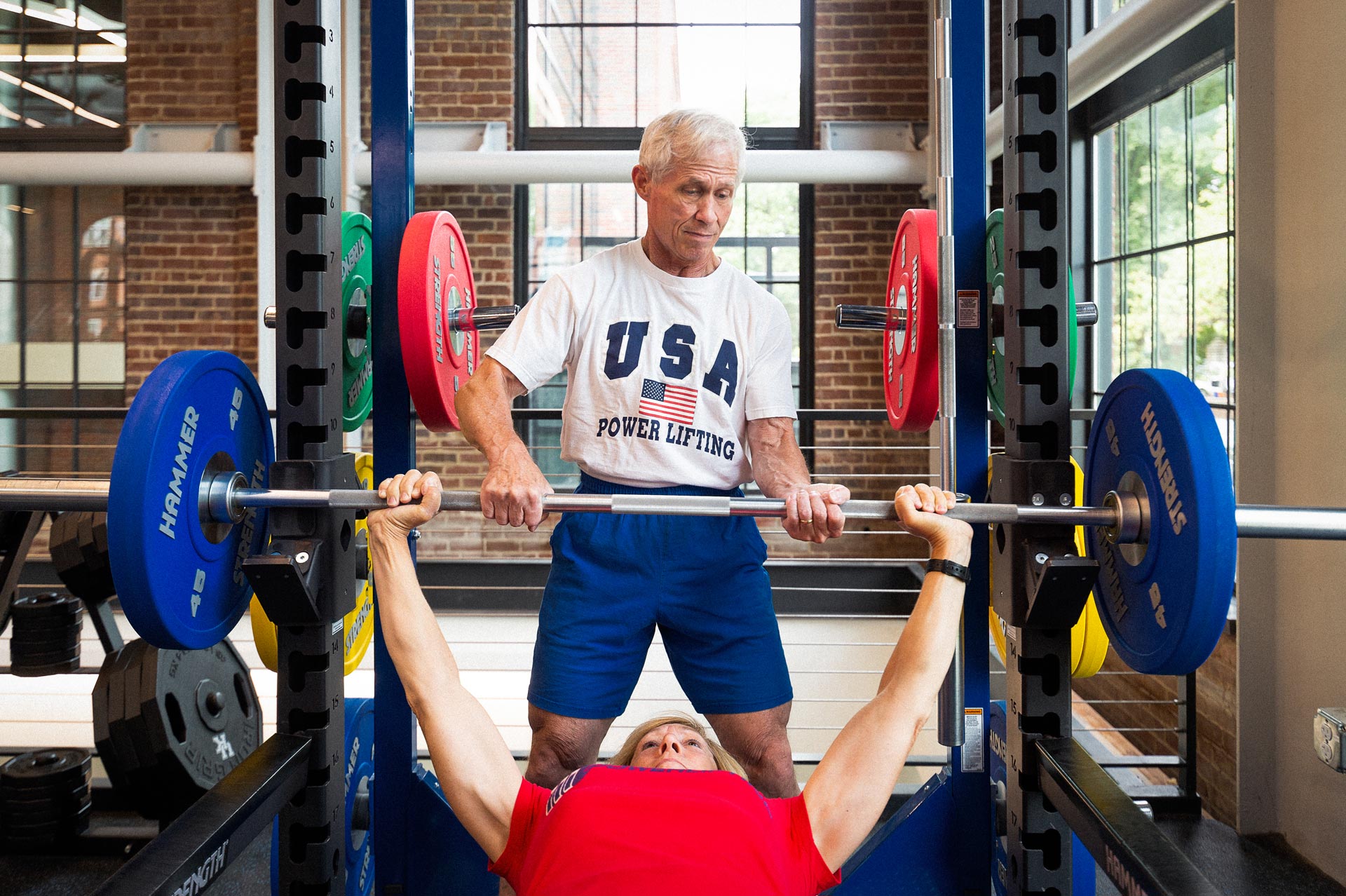 Joe and Cathy Marksteiner lifting weights together