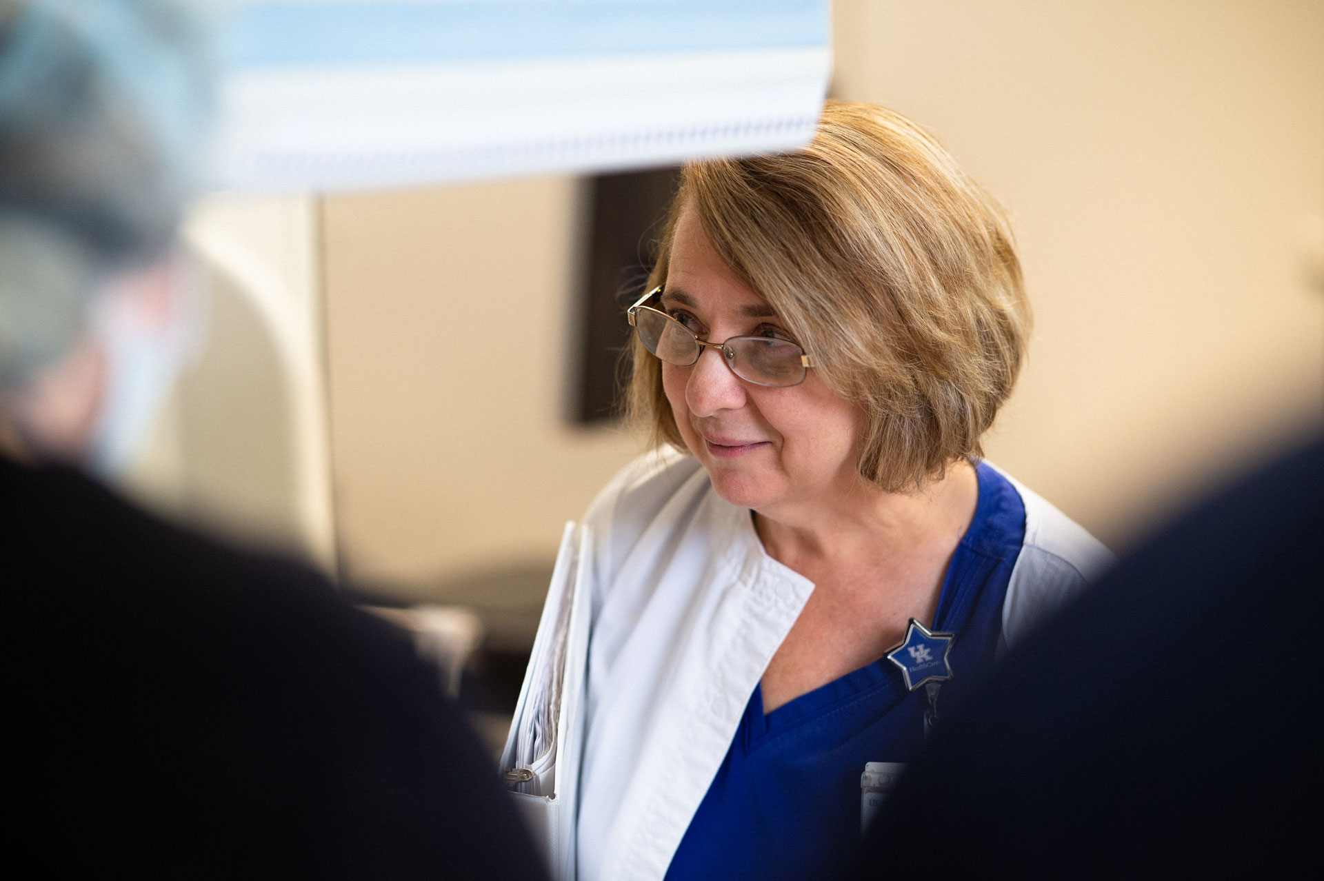 Margie smiles at another nurse.