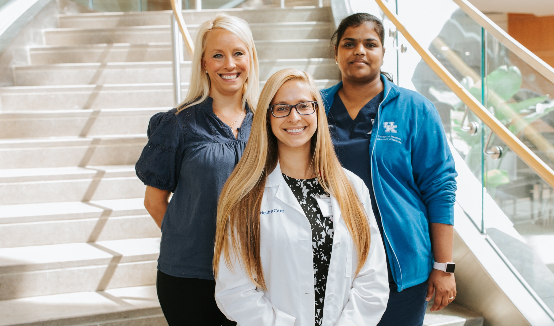 A photo of Dr. Vasireddy, Dr. Ignaszewski, and another doctor together posing together on a staircase in the hospital.