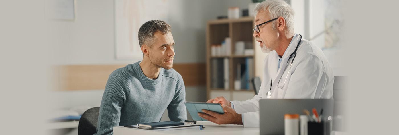 A man has a conversation with his doctor.