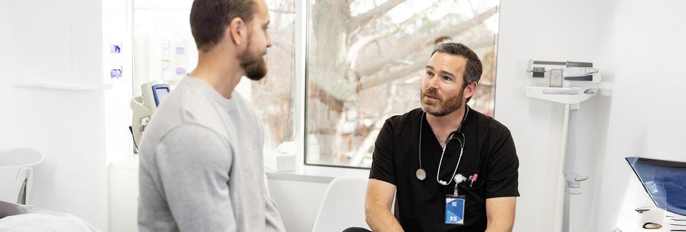 A man speaks with his doctor.