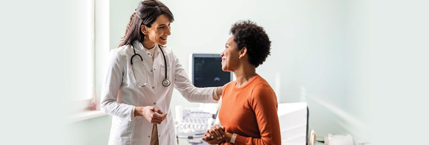 A woman speaks with her doctor.