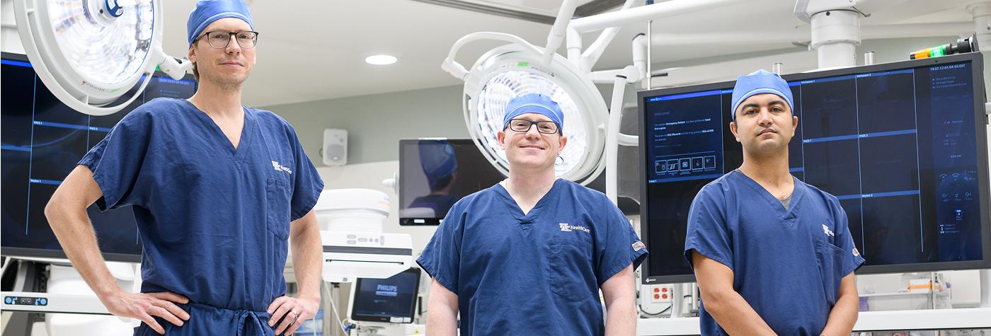 Michael Bounds, MD; Nathan Orr, MD; and Samuel Tyagi, MD are seen in the operating room.