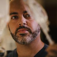 Aaron Harris examining IV bags