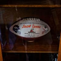 A special football is displayed in a case that says \