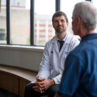 UK HealthCare Markey Cancer Center surgical oncologist Dr. Michael Cavnar discussing treatment options with Joe Marksteiner