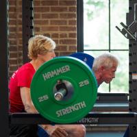 Joe and Cathy Marksteiner lifting weights together