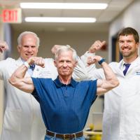 Joe Marksteiner posing with Dr. Michael Cavnar and Dr. Lowell Anthony