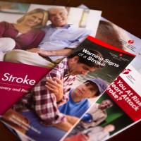 An assortment of pamphlets and booklets about the symptoms of stroke and stroke recovery.