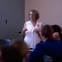Margie educates a room full of nurses on the symptoms of stroke.
