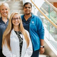 A photo of Dr. Vasireddy, Dr. Ignaszewski, and another doctor together posing together on a staircase in the hospital.